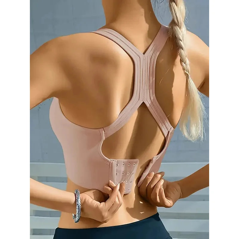 Close-up of stretchy ribbed fabric on women's Athletic Sanctuary seamless crop tank, highlighting its textured material and fit.