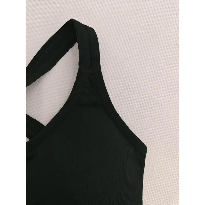 Black women’s ribbed seamless crop tank top by Athletic Sanctuary, close-up view showing fitted, stretchy fabric and ribbed texture.