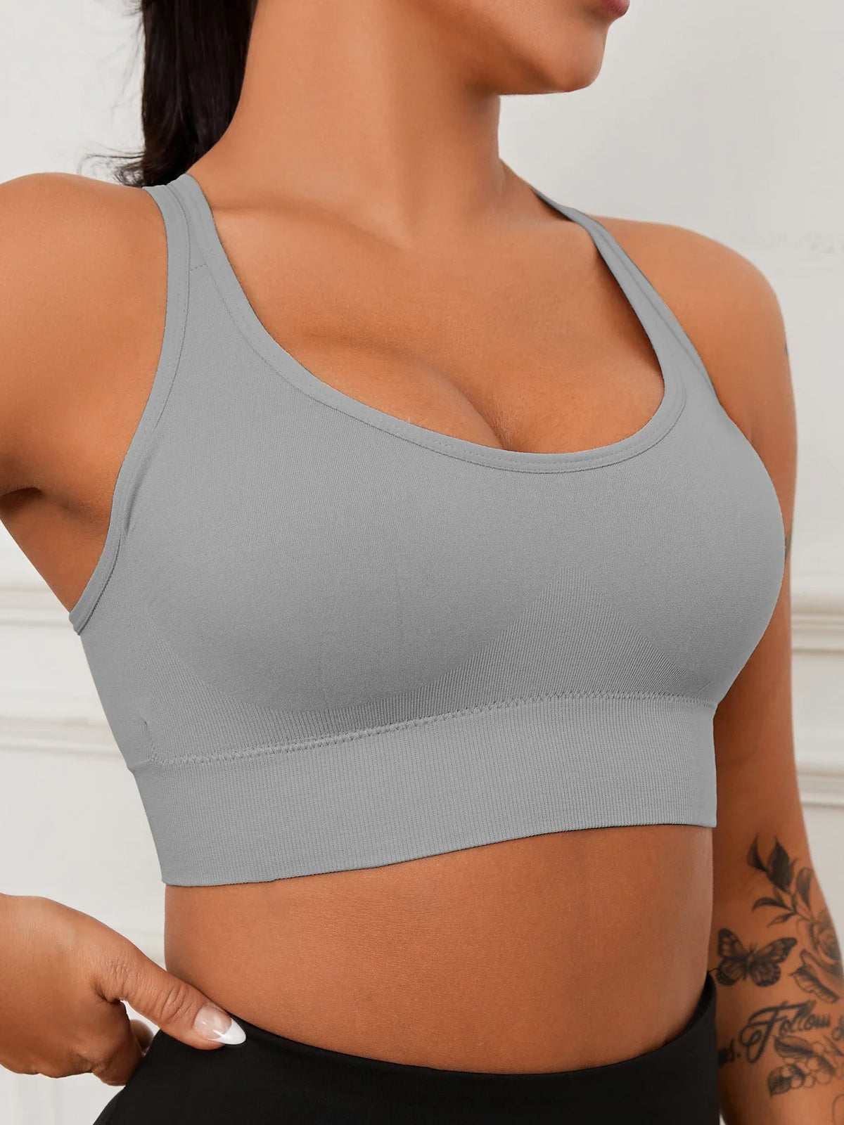 Women’s ribbed seamless crop tank by Athletic Sanctuary, showing a close-up of the fitted, ribbed fabric and sleeveless design.