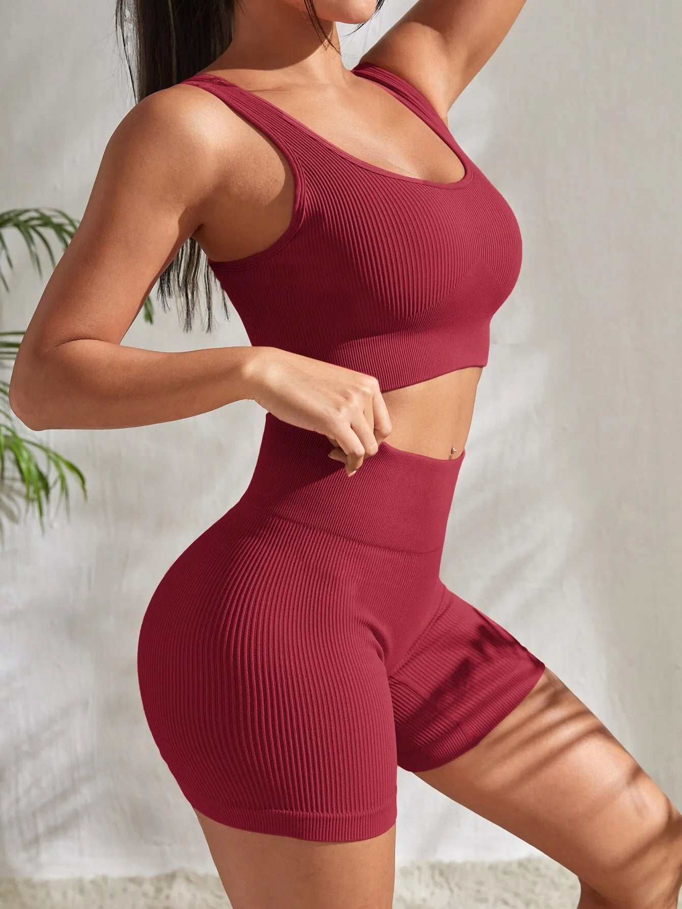 Women’s ribbed seamless gym set by Athletic Sanctuary with crop tank and high-waist shorts, displayed on a neutral background.