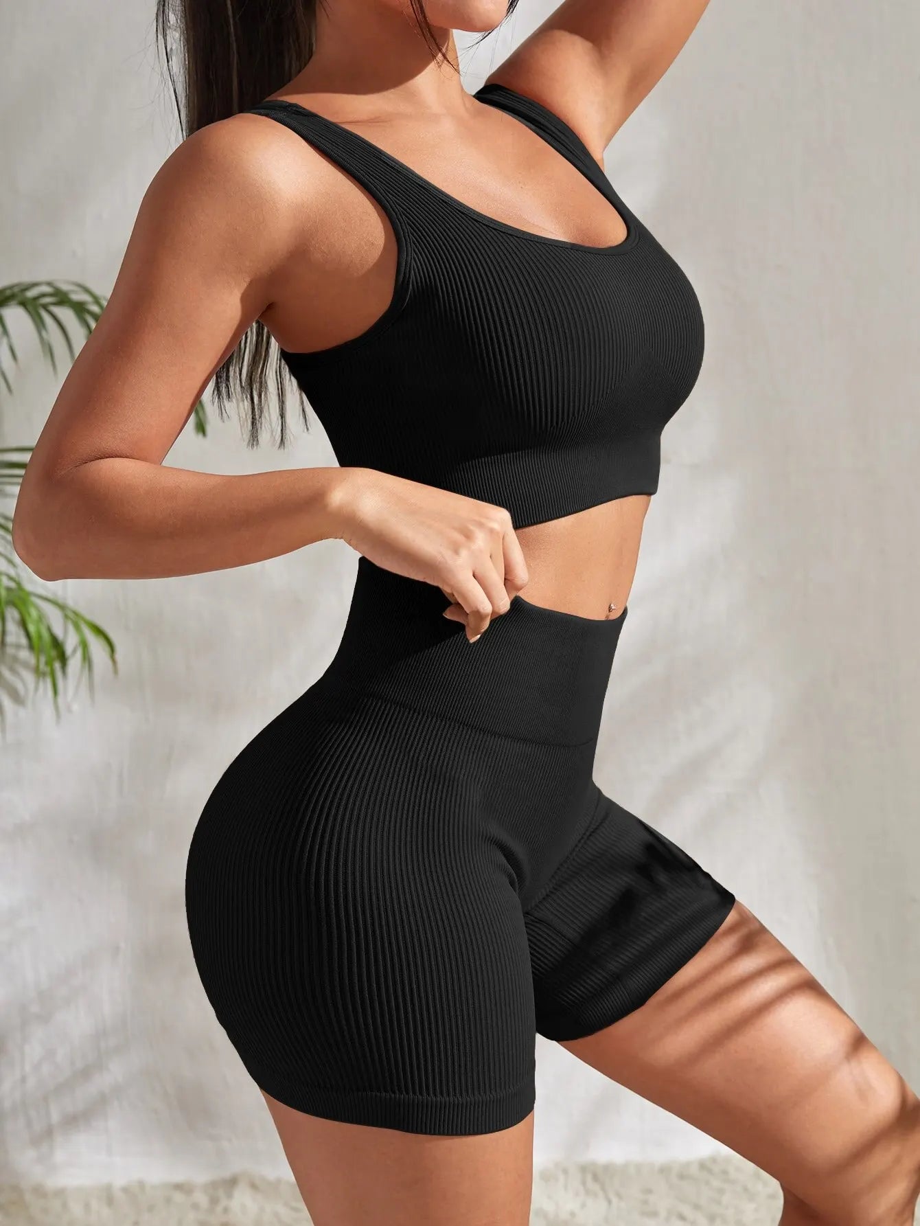 Women’s ribbed seamless gym set with crop tank and high-waist shorts from Athletic Sanctuary, shown in a stylish fitness outfit.