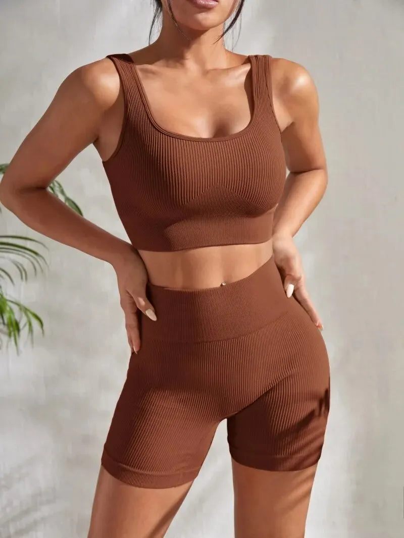 Women’s ribbed seamless gym set with crop tank and high waist shorts by Athletic Sanctuary, shown in a stylish, fitted design.