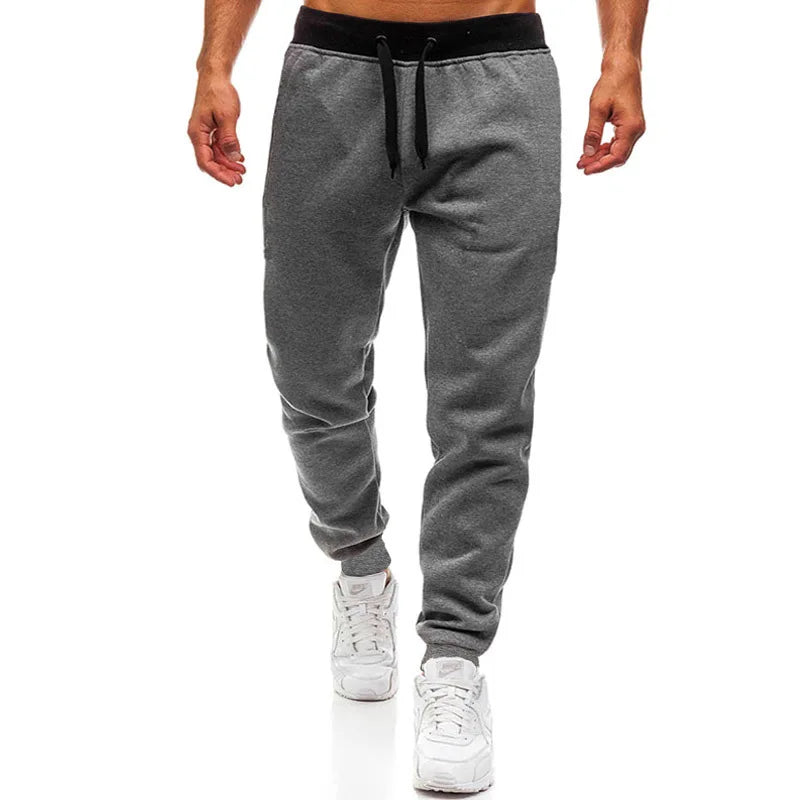 Men’s fleece-lined athletic joggers by Athletic Sanctuary, loose fit sweatpants with comfortable, cozy fleece interior and athletic style.