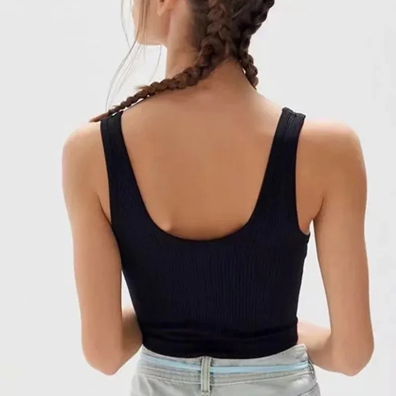 Black women's seamless ribbed wireless sports camisole crop top by Athletic Sanctuary, designed for comfortable active wear.