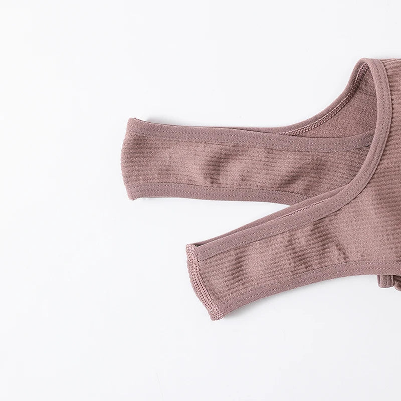 Women’s seamless ribbed wireless sports camisole crop top from Athletic Sanctuary, shown in a close-up of the fitted, ribbed fabric.