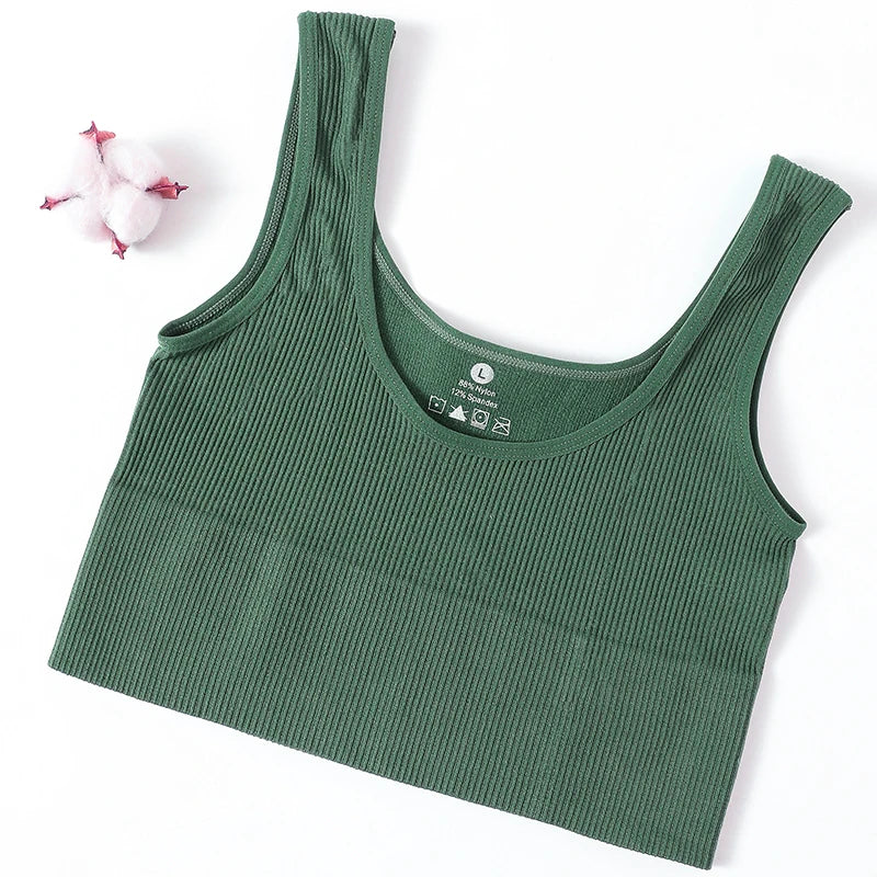Women's seamless ribbed wireless sports camisole crop top by Athletic Sanctuary, shown in a close-up of the fitted, ribbed fabric.