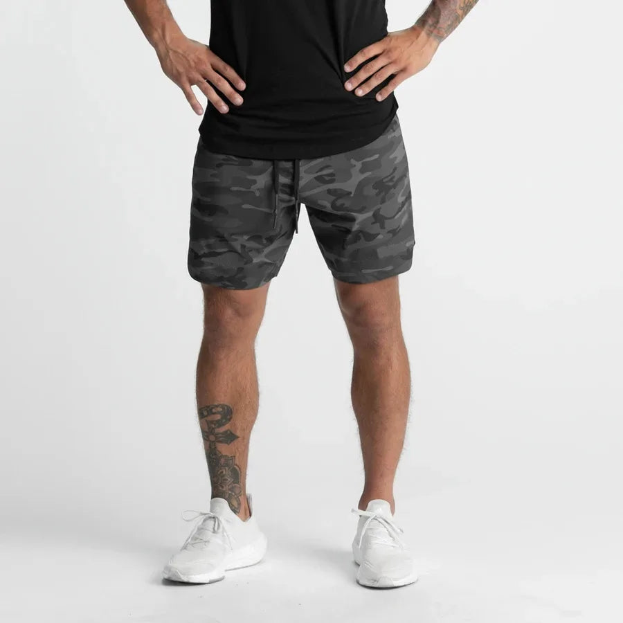 Men's quick-dry performance shorts by Athletic Sanctuary, designed for training and everyday wear, shown in a sleek black color.
