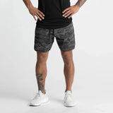 Men's quick-dry performance shorts by Athletic Sanctuary, designed for training and everyday wear, shown in a sleek black color.
