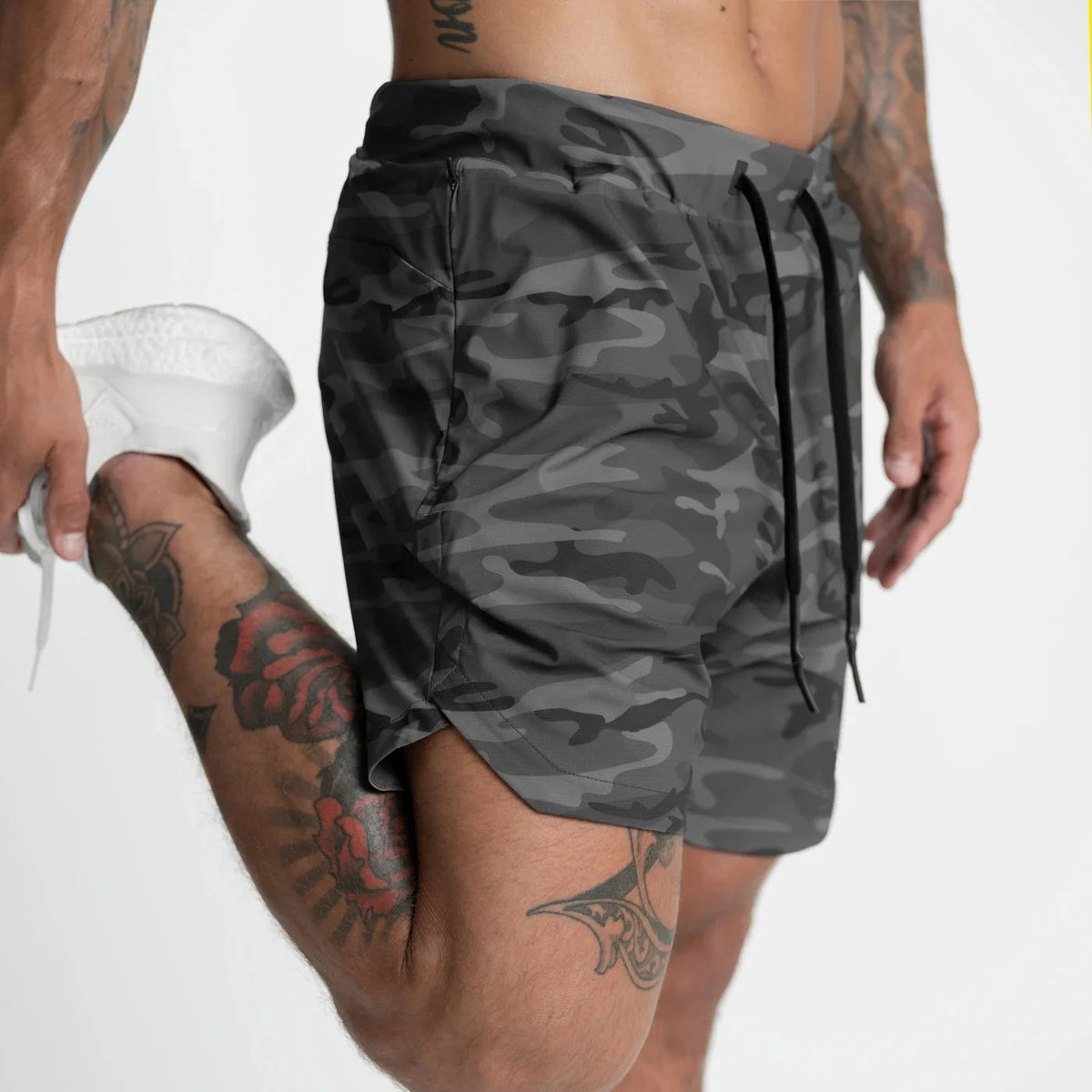 Men's quick-dry performance shorts by Athletic Sanctuary, designed for training and casual wear, shown in a sleek black color.