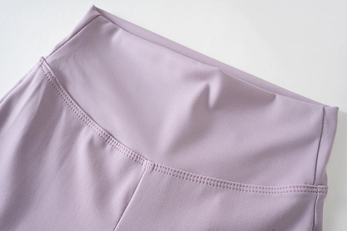 Girls' high-waist flared leggings by Athletic Sanctuary featuring stretch fabric for comfortable everyday movement.