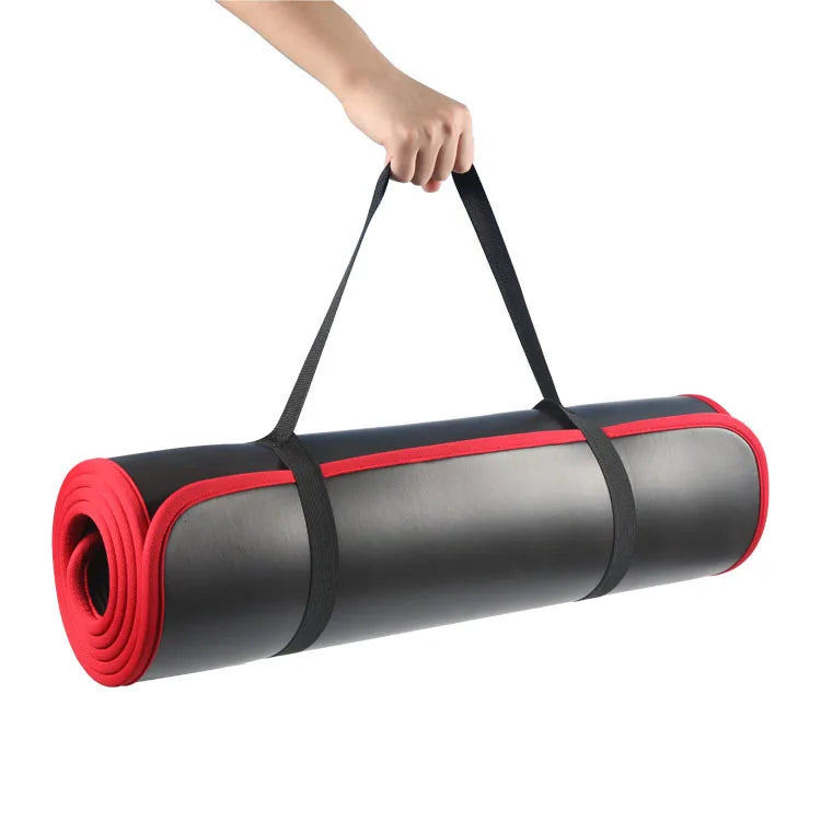 Red and black 10mm thick Athletic Sanctuary yoga mat with non-slip surface, ideal for Pilates and workout sessions.