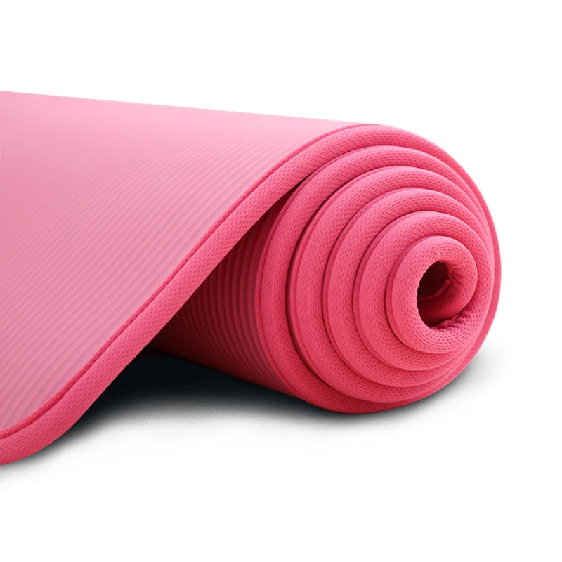 Thick 10mm Athletic Sanctuary yoga mat with non-slip surface, suitable for Pilates and workout routines.