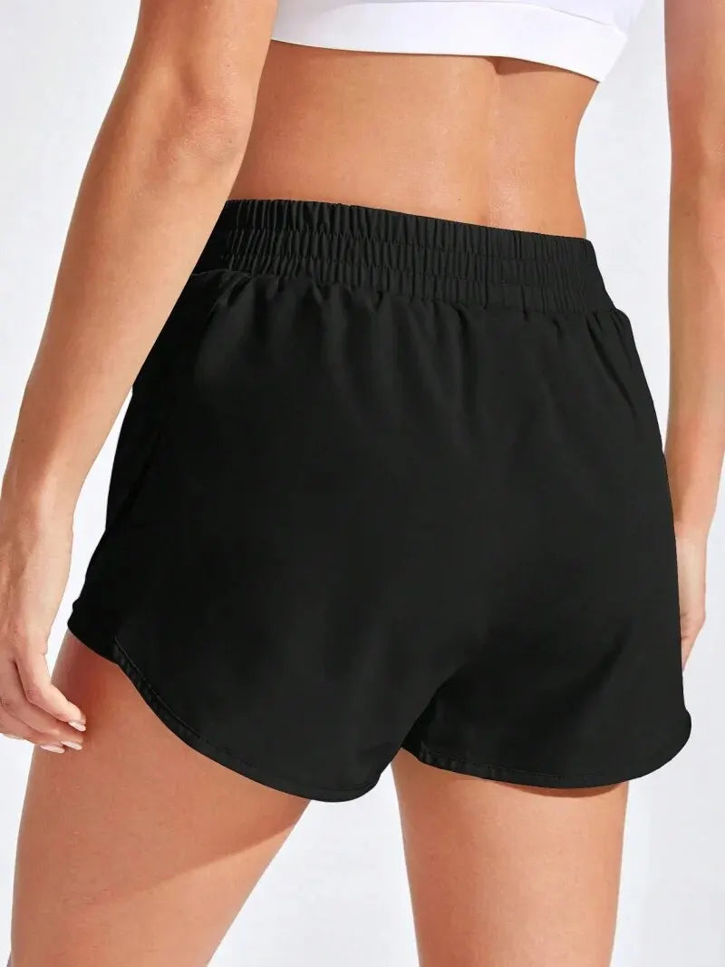 Women’s athletic yoga shorts with high stretch elastic waistband, ideal for fitness and running activities by Athletic Sanctuary.