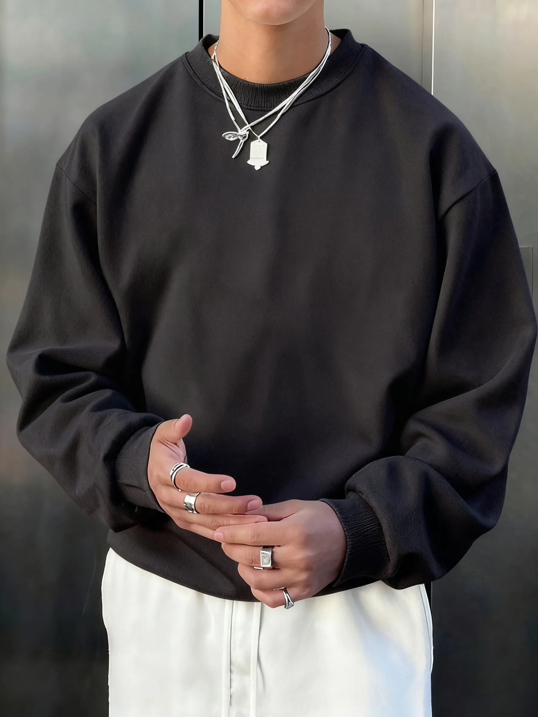 Men’s Athletic Sanctuary fleece pullover sweatshirt showing soft, casual streetwear style in a close-up view.