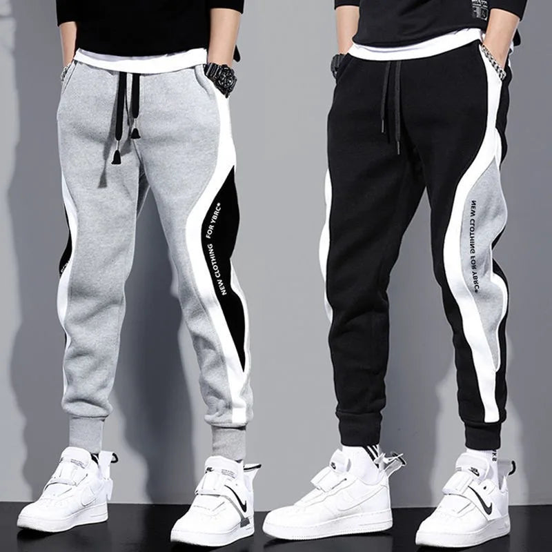 Men’s casual joggers with breathable fabric and sporty patchwork design, loose fit sweatpants by Athletic Sanctuary.