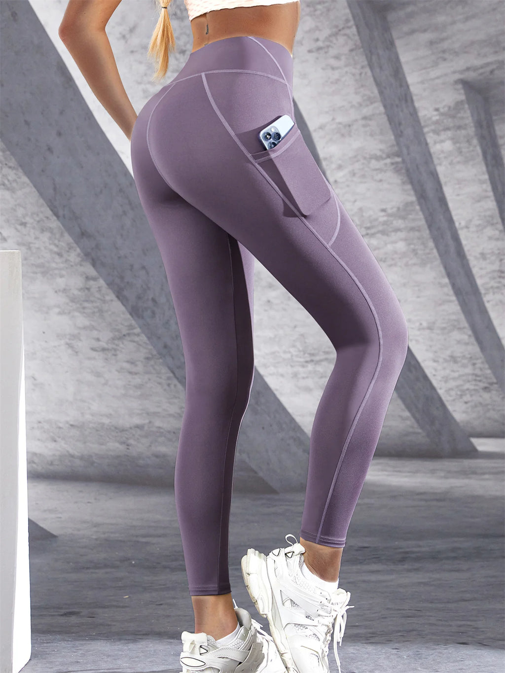 Women’s high-waist performance leggings by Athletic Sanctuary featuring stretch fit and side pockets for active wear.