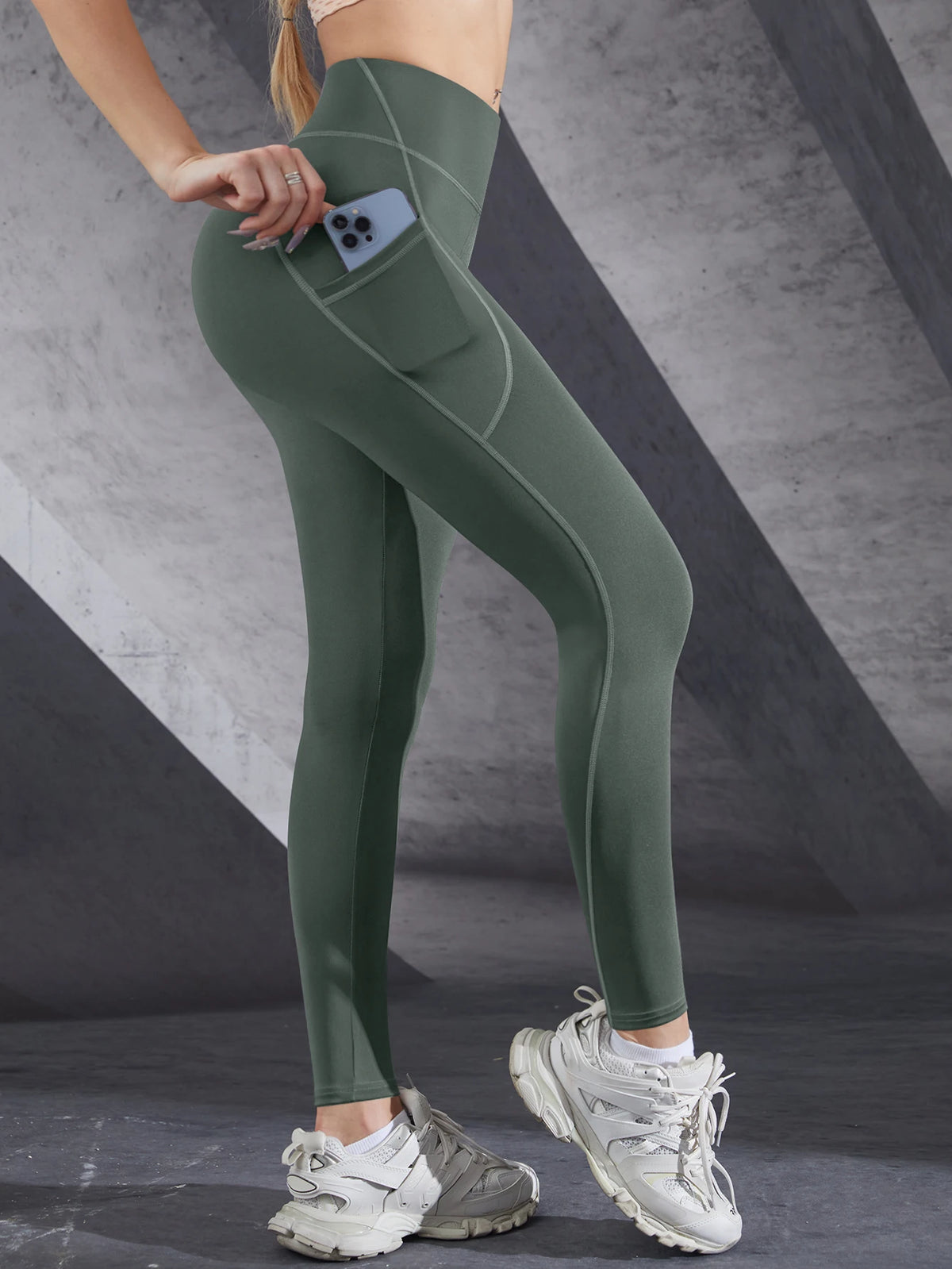 Women's high-waist performance leggings by Athletic Sanctuary, stretch fit with side pockets, shown on a model for active wear.