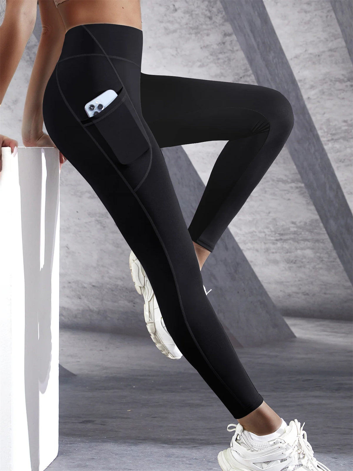 Women’s high-waist performance leggings by Athletic Sanctuary with stretch fit and side pockets, shown in black, on a plain background.