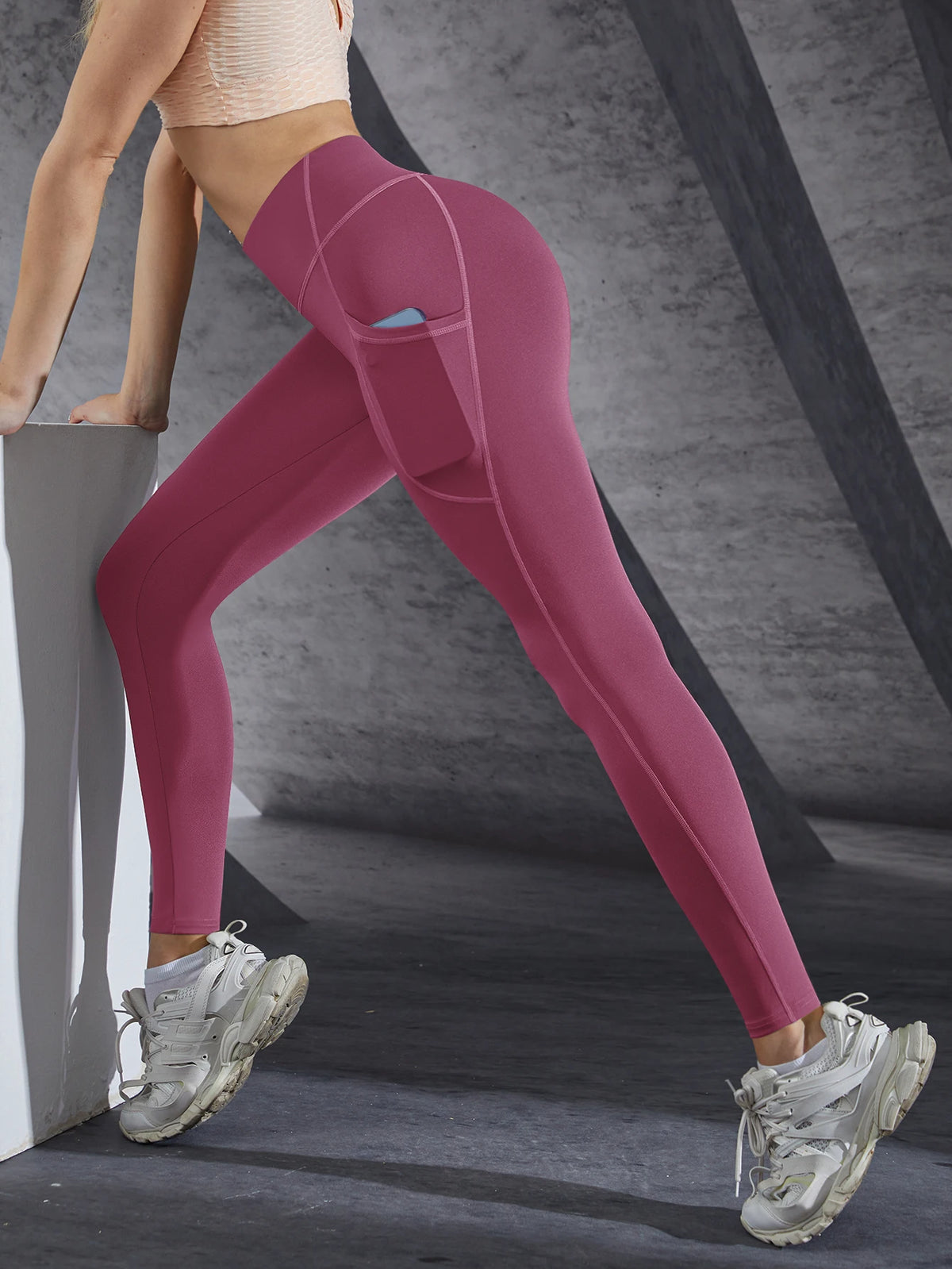 Women’s high-waist performance leggings by Athletic Sanctuary featuring stretch fit and side pockets, shown on a model.