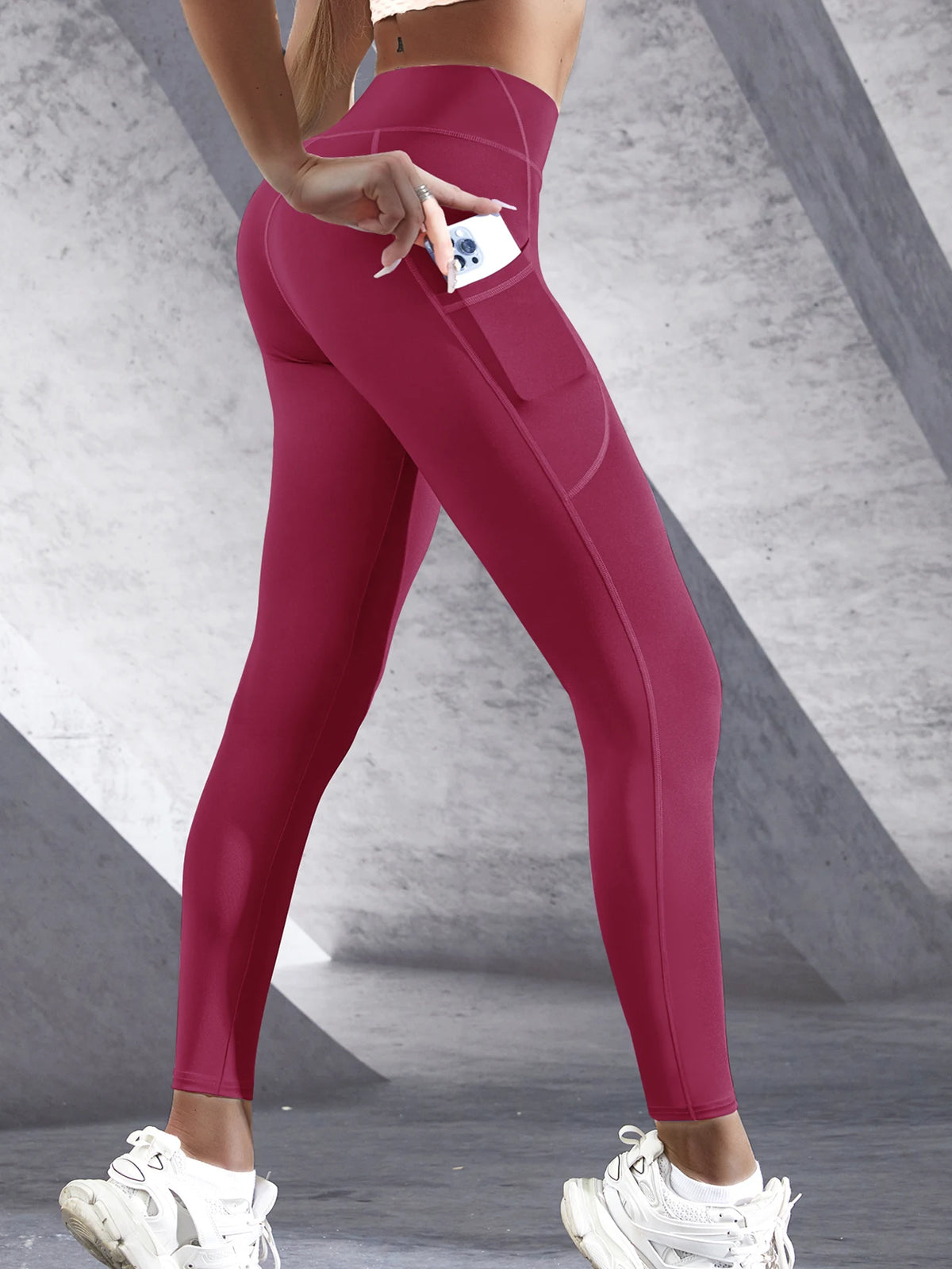 Women's high-waist performance leggings by Athletic Sanctuary, stretch fit with side pockets, shown on a model in a workout pose.