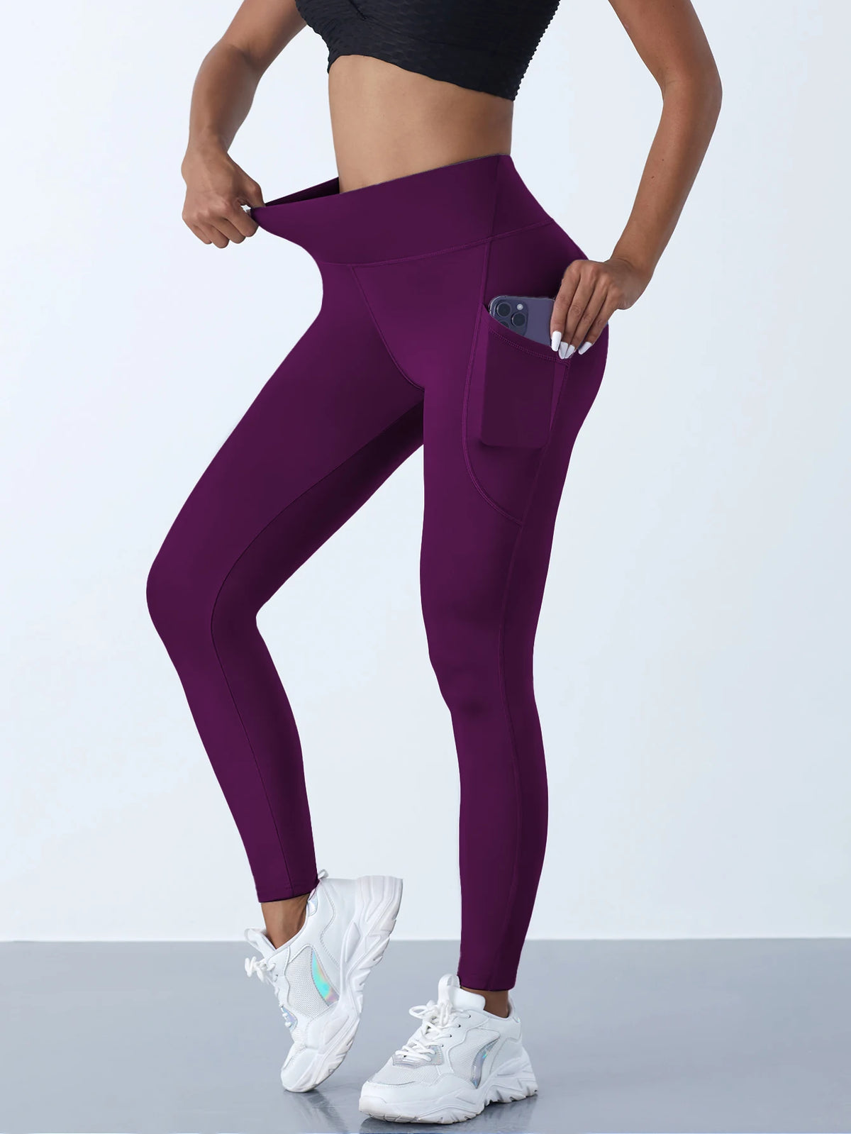 Women’s high-waist performance leggings by Athletic Sanctuary with stretch fit and side pockets, shown in black on a model.